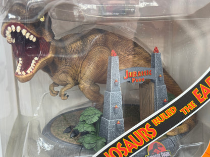 Jurassic Park "T-Rex Park Gate" Mini Co. PVC Figur T-Rex Illusion Deluxe 15 cm (2024)